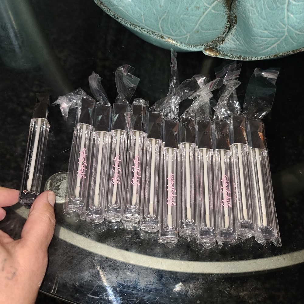 New in package empty lip glass containers. I took one out to get better pic. 11
